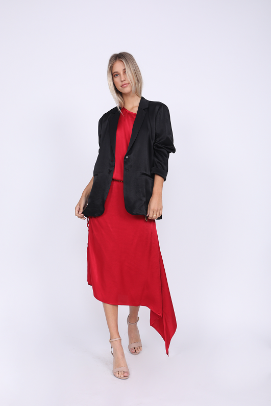 Model is wearing the Hayley Blazer in black with the Hayley Asymmetric Shoulder Dress in red underneath. Also worn with open toe, ankle strap, nude color high heels.