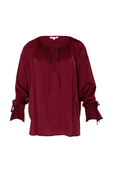 The Pleasant Wrap Front Tie Top in burgundy.