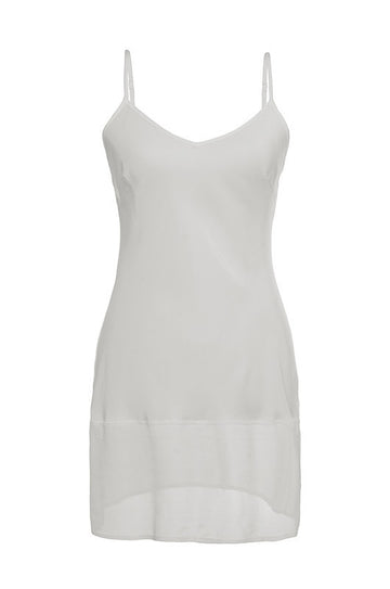 The Sheer Edge Silk Tunic in white.