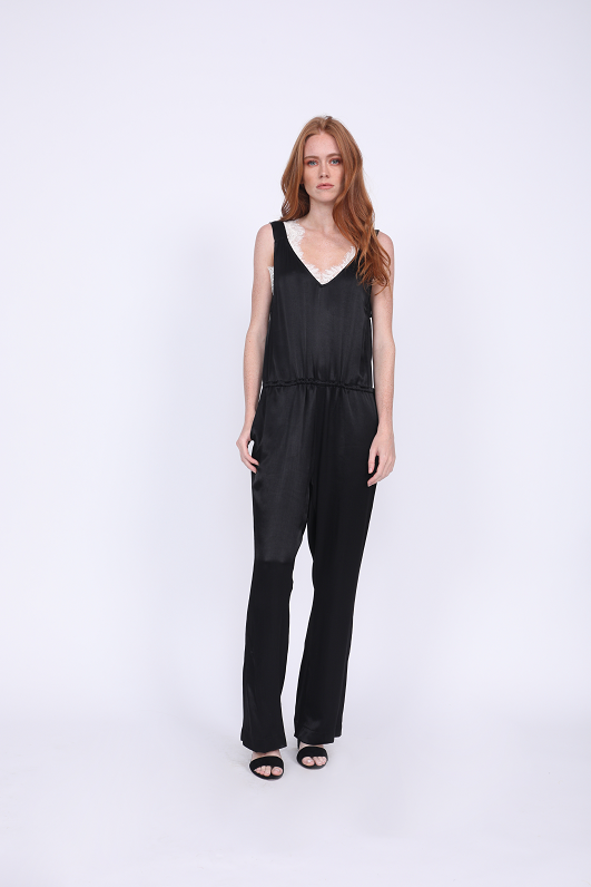 Model is wearing the Hayley Jumpsuit in black with the Megan Camisole in black/dove underneath.